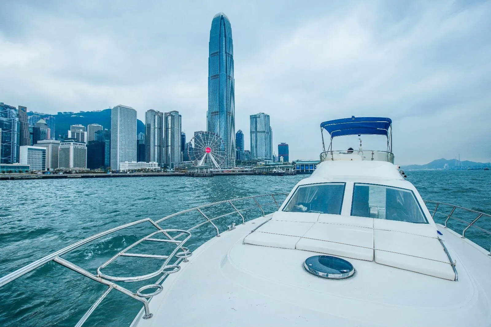 The bow of Kingdom 53 with the IFC tower ahead
