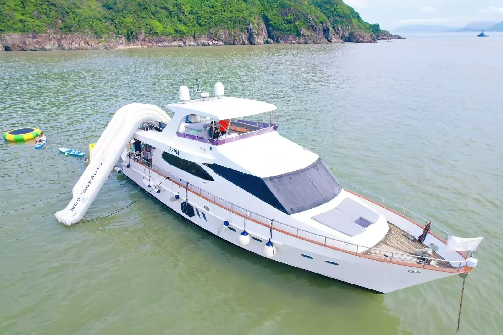 Kingdom 72 at anchor with its water slide